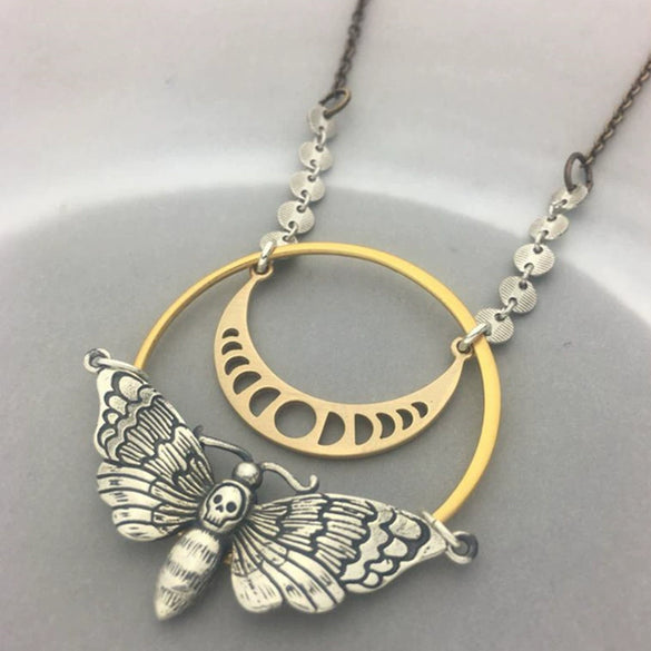 Retro Twining Moonstone Necklace With Dyed Black Feather And Inlaid Turquoise Pendant Moon Skull Moth Design Alloy Material Electroplating Treatment