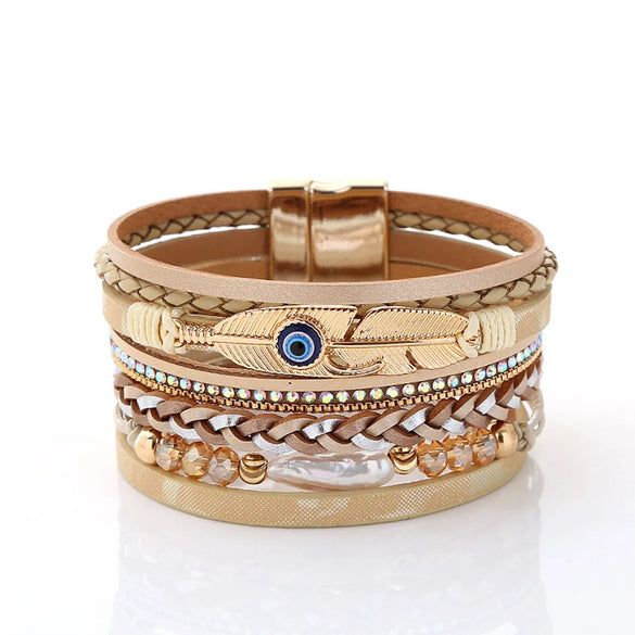 Retro Vacation Leaf Eye Feather Pu Leather Imitation Pearl Alloy Layered Women'S Bracelets