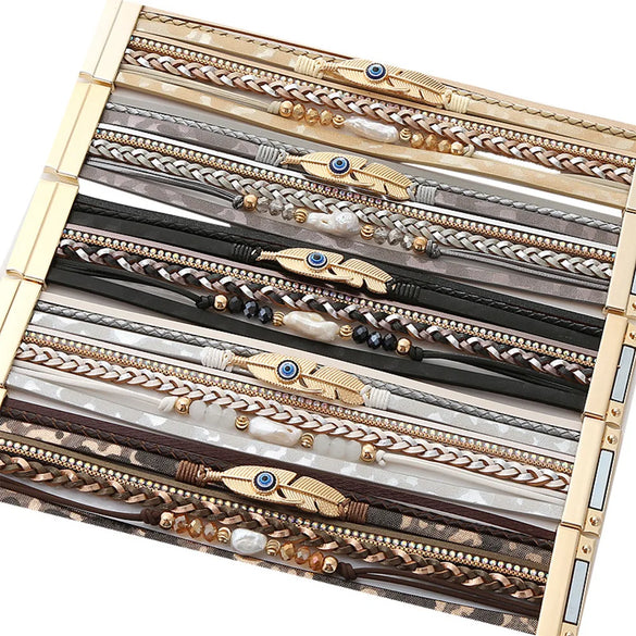 Retro Vacation Leaf Eye Feather Pu Leather Imitation Pearl Alloy Layered Women'S Bracelets