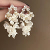 Silver Needle Earrings With Diamond Inlaid Imitation Pearl Petals And Tassel Geometric Shape High End And Versatile Design