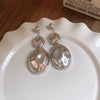 Silver Needle Pattern Oval Tassel Metal Earrings For Women With Electroplating Design