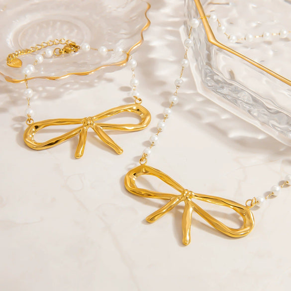 Stainless Steel And Pearl Women's Fashion Clavicle Chain And Bracelet Set With French Bow And Butterfly Design Electroplated
