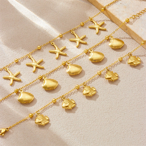 Stainless Steel Goldplated Animal Zodiac Style Bracelet With Tropical Fish Starfish Scallop Design