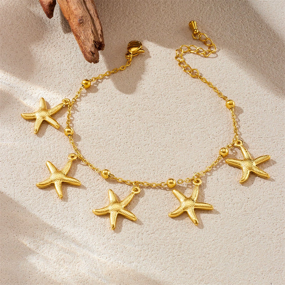 Stainless Steel Goldplated Animal Zodiac Style Bracelet With Tropical Fish Starfish Scallop Design