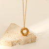 Stainless Steel Women's Necklace With 18K Gold Hollow Round Inlaid Zircon Pendant And Electroplating Treatment