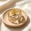 Three Dimensional Floral Enamel Cuff Bracelet With Gilded Finish And Adjustable Open Design For Modern Everyday Styling