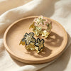 Three Dimensional Floral Enamel Cuff Bracelet With Gilded Finish And Adjustable Open Design For Modern Everyday Styling