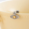 Titanium Steel Inlaid Zircon Lady Saturn Perforated Earrings