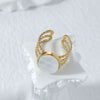 Vintage Embossed Stainless Steel Hollow Ring With Natural White Fritillaria Turquoise