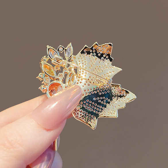 Wholesale Alloy Crystal Retro Hollow Maple Leaf Flower Brooch For Women With Electroplating