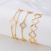 Wholesale Alloy Electroplated Exaggerated Geometric Hollow Fourleaf Clover Bracelet And Adjustable Ring Set For Women