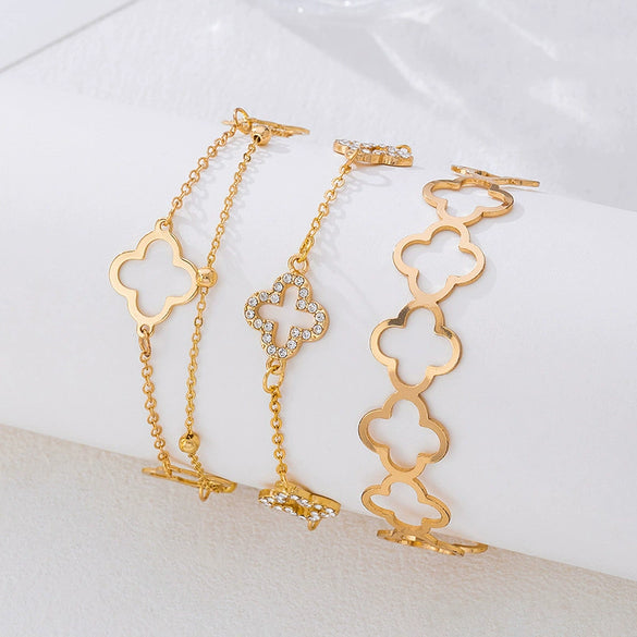 Wholesale Alloy Electroplated Exaggerated Geometric Hollow Fourleaf Clover Bracelet And Adjustable Ring Set For Women