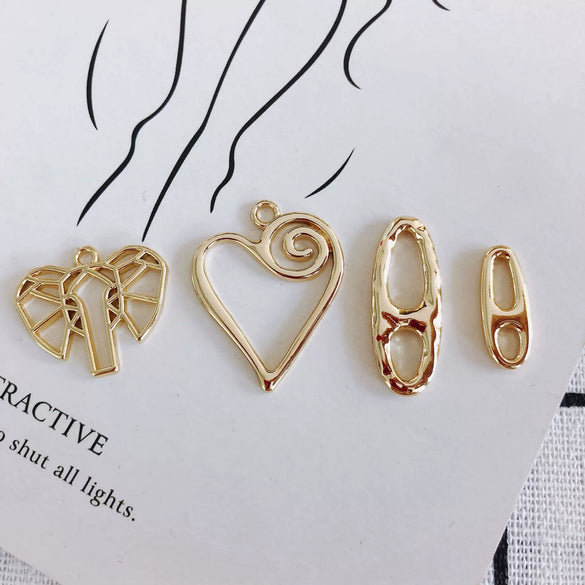 Wholesale Alloy Electroplated Jewelry Accessories Abstract Elephant Sunflower Heart Shaped Pendant Earrings