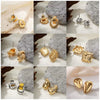 Wholesale Alloy Fashion Geometric And Heart Shape Electroplated Earrings
