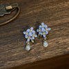 Wholesale Alloy Flower Shape Electroplated Silver Needle Flower Leaves Tassel Earrings For Women Fashion Retro High End