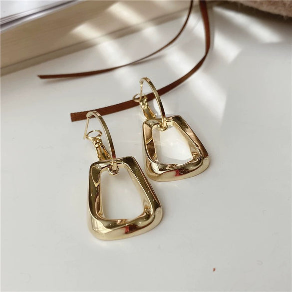Wholesale Alloy Geometric Hollow Women's Earrings With Goldplated Electroplating And S925 Silver Needles