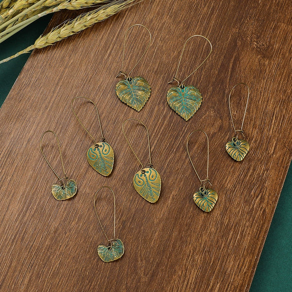 Wholesale Alloy Geometric Oval Spiral Hollow Pendant Earrings For Women Electroplated Retro Bohemian Style