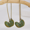 Wholesale Alloy Geometric Oval Spiral Hollow Pendant Earrings For Women Electroplated Retro Bohemian Style