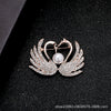 Wholesale Alloy Natural Style Leaf Feather Rhinestone And Pearl Brooch With Flower Pattern And Electroplating Treatment For Ladies