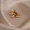 Wholesale Alloy Pearl Bow Antirunning Light Brooch For Women Electroplated Minimalist Style Collar Pin Corsage Accessory