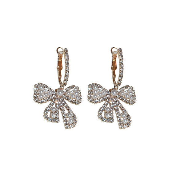 Wholesale Alloy Pearl Inlaid Bow Earrings For Women Silver Needle Light Luxury Personality Style
