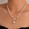 Wholesale Alloy Pearl Necklace With Diamondencrusted Bow Pendant Electroplated Women's Retro Fashion