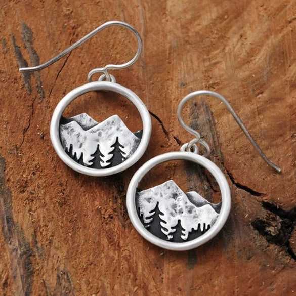 Wholesale Alloy Vintage Three Dimensional Round Hollow Mountain Geometric Pendant Earrings For Women With Electroplating Treatment