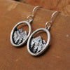 Wholesale Alloy Vintage Three Dimensional Round Hollow Mountain Geometric Pendant Earrings For Women With Electroplating Treatment