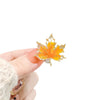 Wholesale Alloy Women's Vintage Natural Style Flower Pattern Electroplated Maple Leaf Antiexposure Brooch Clothes Pin Accessories