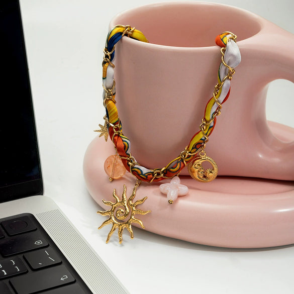 Wholesale Ancient Style Orange Printed Headscarf With Stainless Steel Electroplated Sun And Moon Pendant Jewelry For Women