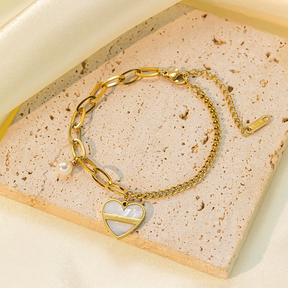 Wholesale Asymmetrical Pearl Heart Pendant Titanium Steel Bracelet For Women With Electroplating Design