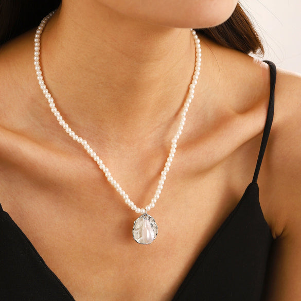 Wholesale Bohemian Style Imitation Pearl Beaded Necklace With Alloy Vintage Shell Pendant And Geometric Pattern Electroplated For Women