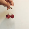 Wholesale Cherry Petal And Cherry Fruit Stud Earrings Made Of Alloy With Dripping Oil