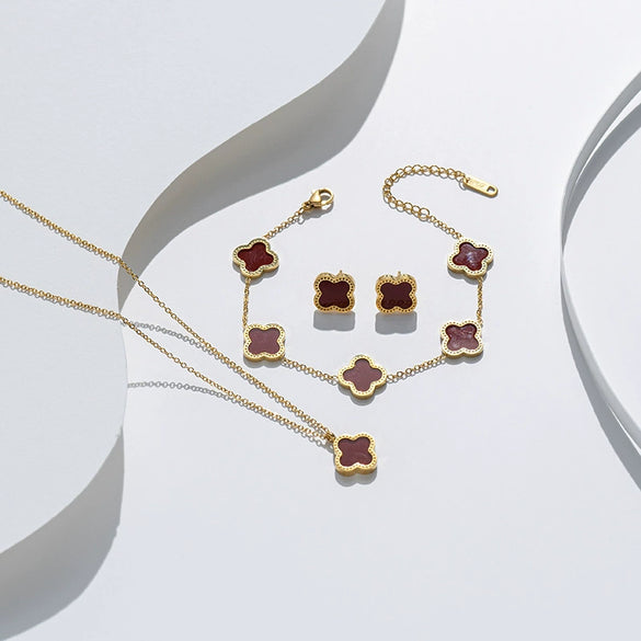 Wholesale Clover Shell Titanium Steel Pendant Accessories Necklace Bracelet Stud Earrings Jewelry Threepiece Set With Flower Pattern And Electroplating Treatment For Women