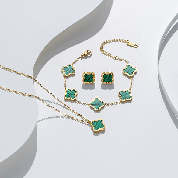 Wholesale Clover Shell Titanium Steel Pendant Accessories Necklace Bracelet Stud Earrings Jewelry Threepiece Set With Flower Pattern And Electroplating Treatment For Women