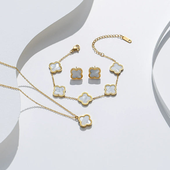 Wholesale Clover Shell Titanium Steel Pendant Accessories Necklace Bracelet Stud Earrings Jewelry Threepiece Set With Flower Pattern And Electroplating Treatment For Women