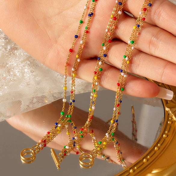 Wholesale Colorful Oil Dropping Bead Gold Multi Layer Bracelet Necklace Set In Titanium Steel With Round Ball Pattern And Gold Plated Electroplating For Women