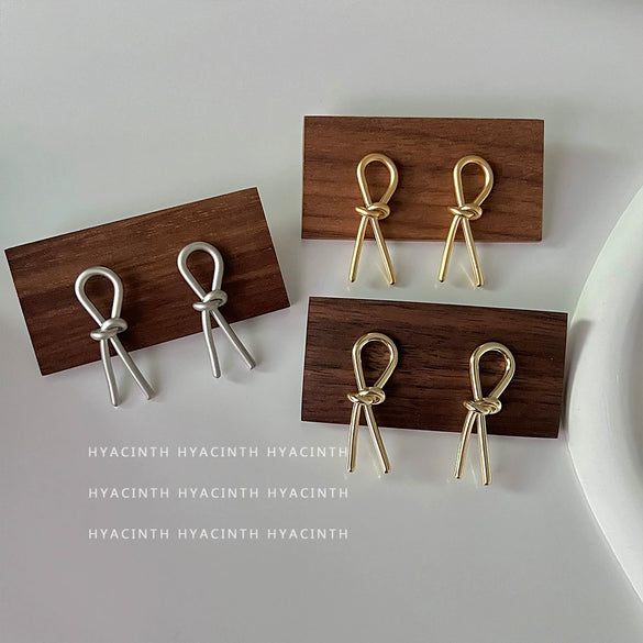 Wholesale Copper Geometric Bow Knot Twisted Matte Electroplated Earrings For Women