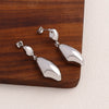 Wholesale Copper Geometric Metal Wind Water Droplets Earrings With Real Gold Plated Electroplating For Women