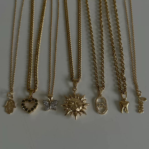 Wholesale Copper Hamsa Hand Love Heart Diamond Butterfly Tooth Big Sun Pendant Zircon Necklace With Geometric Pattern And Diamond Treatment