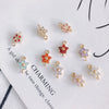 Wholesale Copper Plated Real Gold Hollow Flower Zircon Earrings Jewelry Accessories