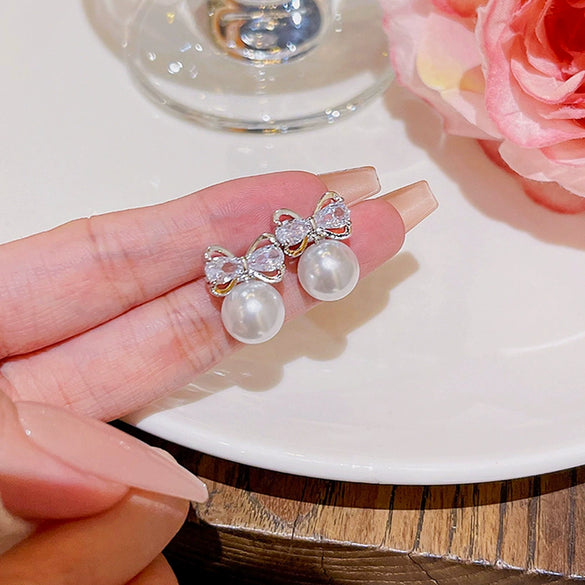 Wholesale Copper 925 Silver Needle Zircon And Pearl Earrings With Sweet Bow Design For Women