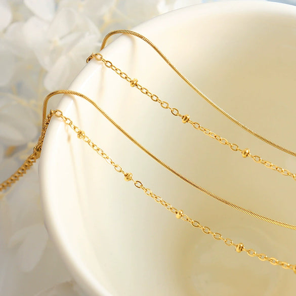 Wholesale Delicate Double Layer Snake Bone Chain And Bag Bead Chain Bracelet In 316L Stainless Steel With Geometric Pattern And 18K Gold Plated Electroplating For Women