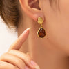 Wholesale Elegant Amber Titanium Steel Geometric Earrings Plated With 18K Gold