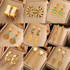 Wholesale Elegant Imitation Pearl Stud And Ear Clip Earrings For Women With Flower And Constellation Patterns Electroplated