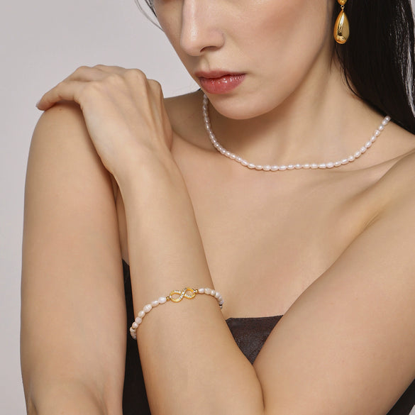 Wholesale Elegant Light Luxury Style Geometric Titanium Steel Bracelet With Natural Freshwater Pearl And 8 Character Diamond Encrusted Electroplating