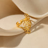 Wholesale Exaggerated Geometric Hollow Flower Stainless Steel 18K Goldplated Asymmetric Ring For Women With Leaves And Wave Pattern