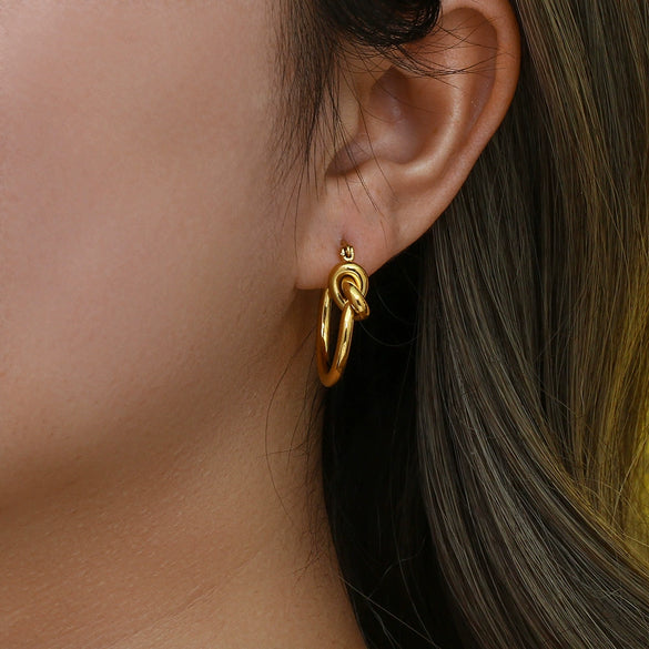 Wholesale Exaggerated Knotted Flat Needle Earrings For Women Golden Titanium Steel Geometric Pattern Electroplated