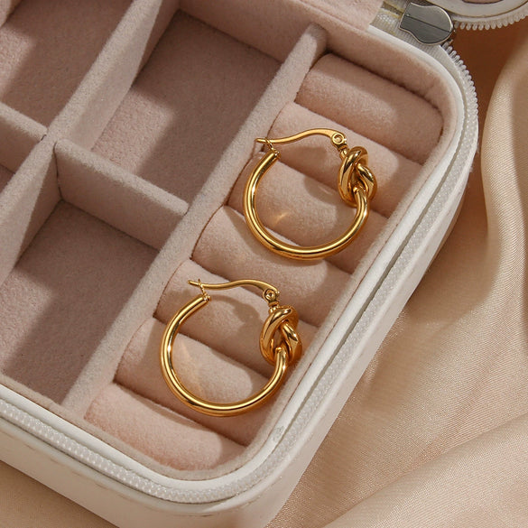Wholesale Exaggerated Knotted Flat Needle Earrings For Women Golden Titanium Steel Geometric Pattern Electroplated
