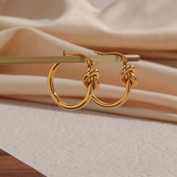 Wholesale Exaggerated Knotted Flat Needle Earrings For Women Golden Titanium Steel Geometric Pattern Electroplated